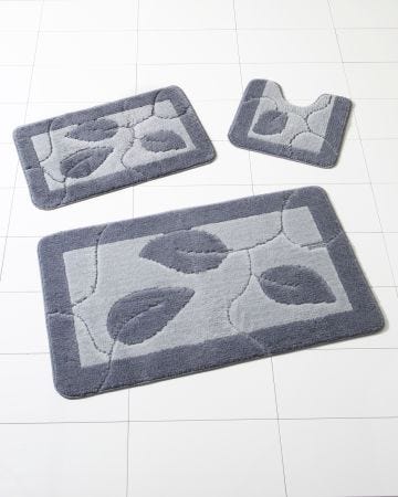 Tapis de bain motif feuilles.
