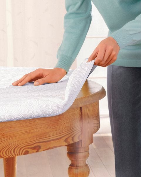 Protège-table forme housse.
